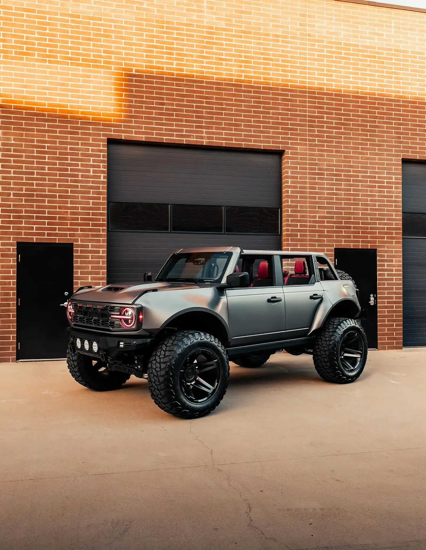 Front end shot of a modified bronco, with matte Paint Protection Film Plano Ready